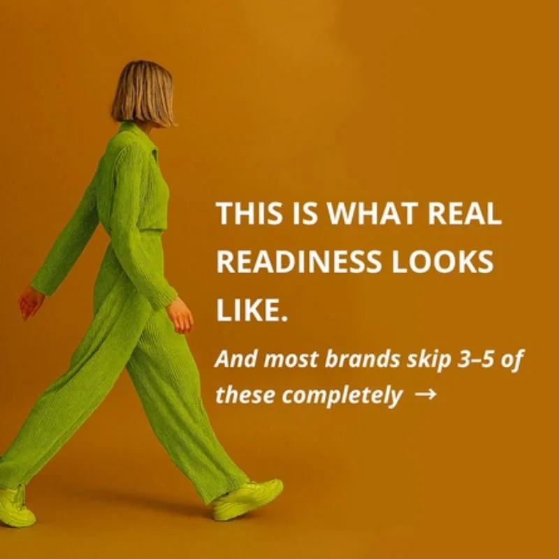 Woman in green suit walking with orange background