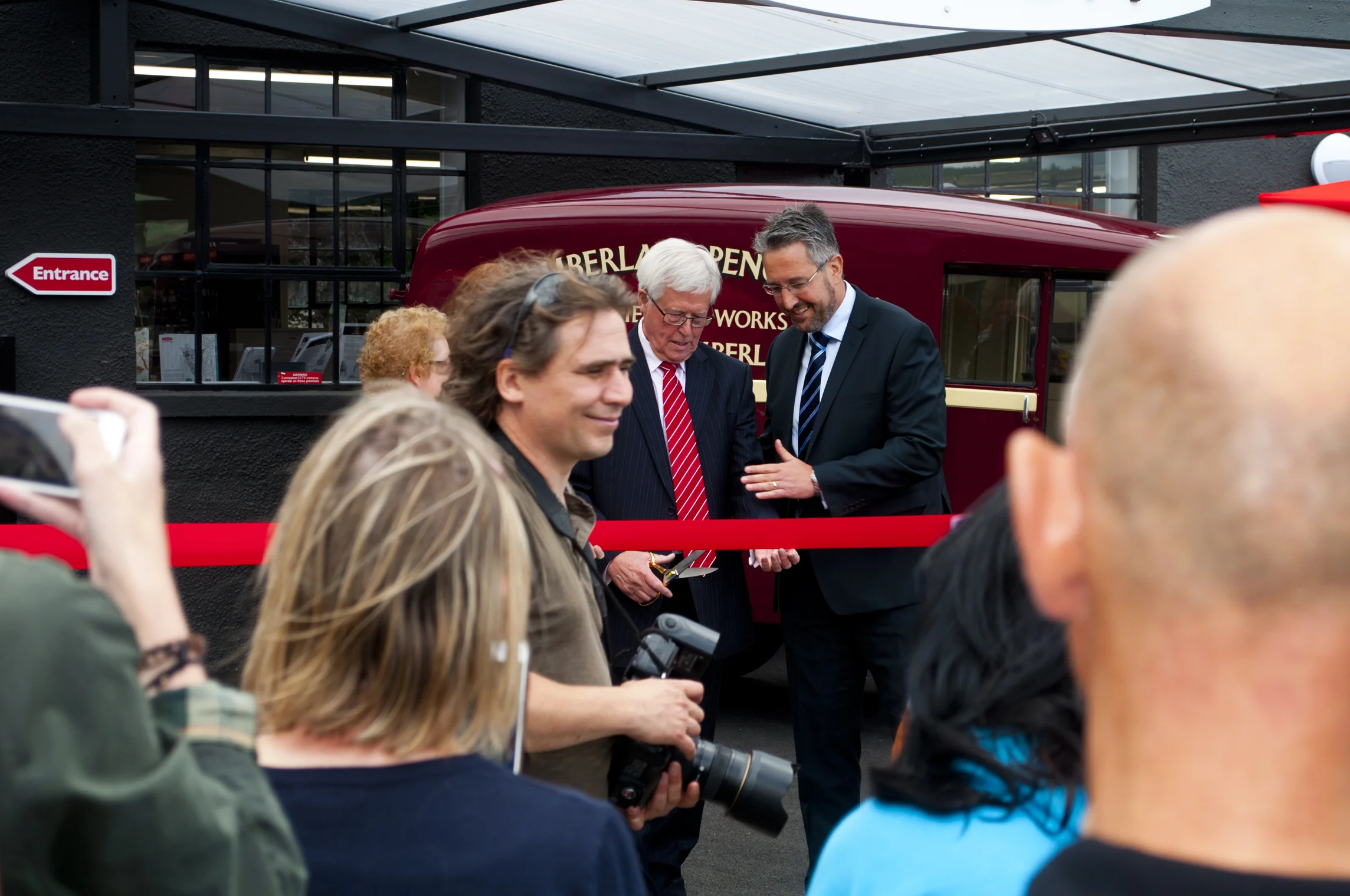 John Craven Cutting the Ribbon 