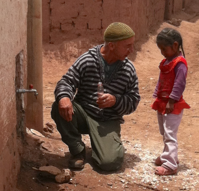 Dean and child tasting water.jpg