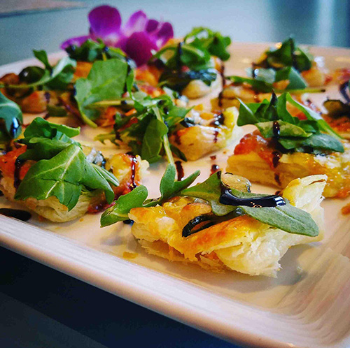 Zucchini, pesto tartes with arugula and aged balsamic