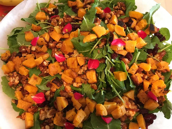 Fall salad: baby kale, toasted pumpkin seeds, butternut squash, candied walnuts, cranberries and orange dressing