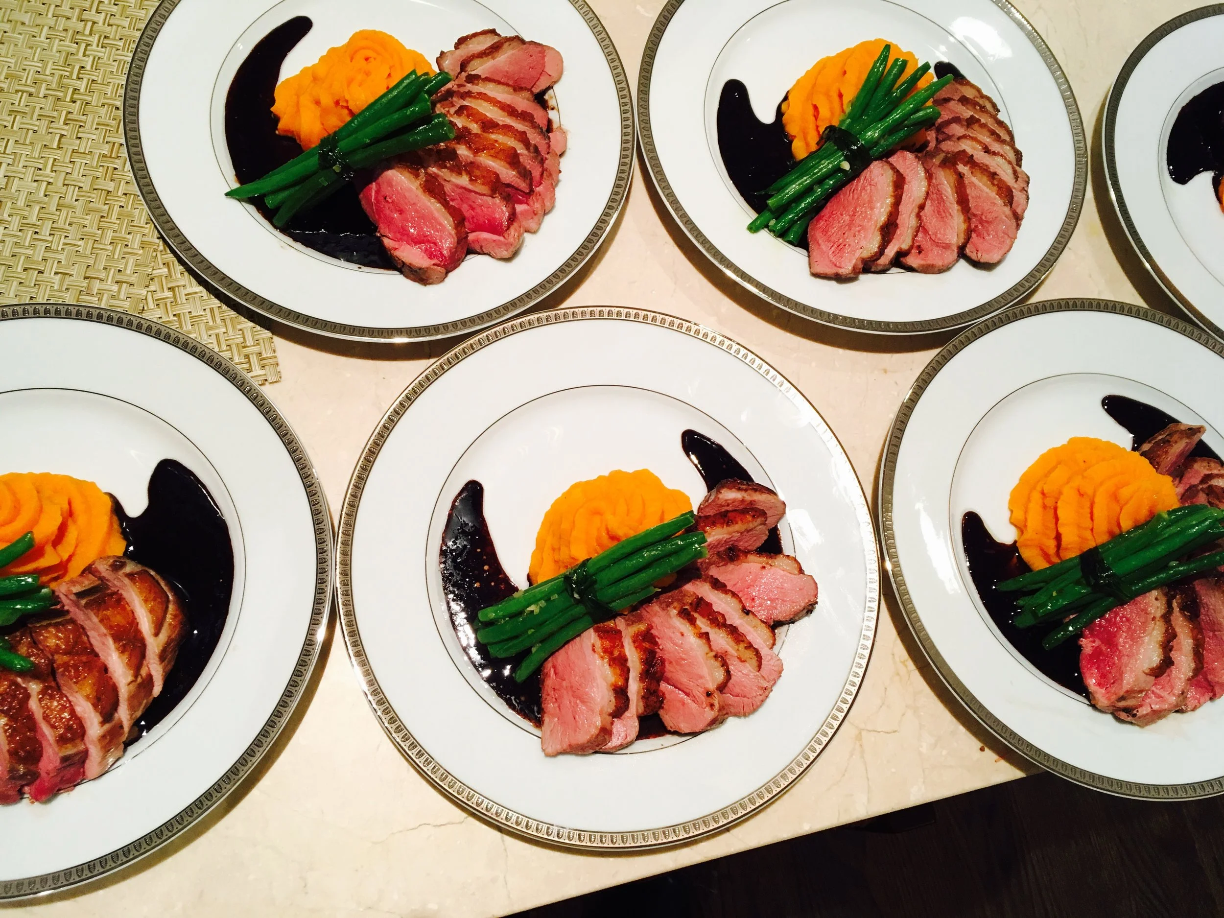 Pan Roasted Duck Breast with Sweet Potato Purée, Haricots Verts, and a Cassis Reduction