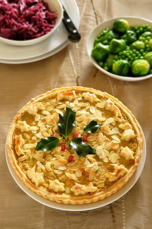 Smoky leek and almond tart - with decorative holly, don’t eat that. Might scratch.