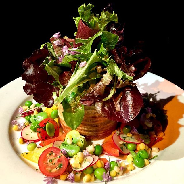 Eating the rainbow has never been so easy and beautiful! Tonight&rsquo;s Special, the Spring Vegetable #Salad: Fava beans, English peas, cherry tomatoes, radish, red and yellow bell peppers, mixed greens, with a hand wrapped potato basket. 🥗🤩 #dbar