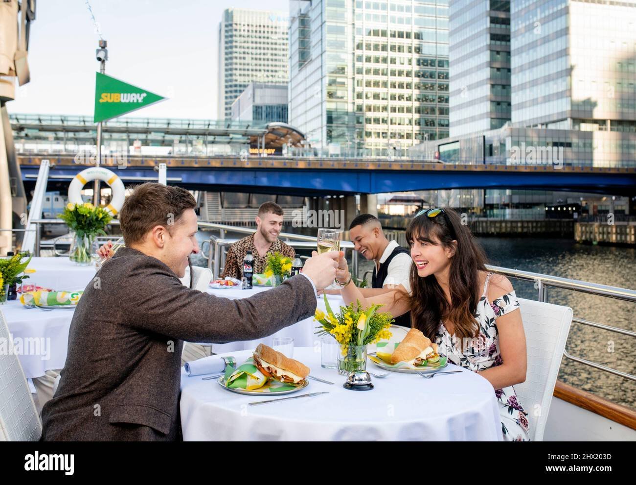 editorial-use-only-oliver-left-and-shelly-from-london-at-the-launch-of-the-subway-pop-up-champagne-and-subs-restaurant-aboard-a-yacht-on-the-thames-river-in-london-issue-date-wednesday-march-9-2022-2HX203D.jpg