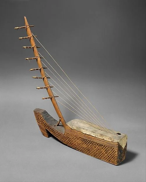 A Ngombi (arched harp) from the Fang/Kele people of Gabon.