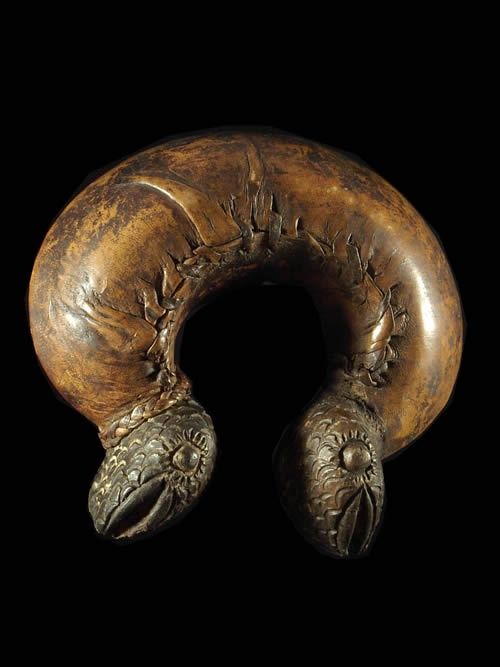 A rattle bracelet from Cameroon or Chad. Clay covered with leather. This has balls within it that as you shake it around it rattles.