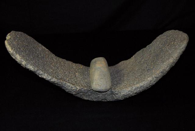 A mill and grinding stone made of vesicular basalt, found in the Ténéré desert at an exposed Sahara site in Niger. Tenerean African Neolithic Period: 7,500 - 4,000 years ago. Mill is 18" long x 6" wide. Grinding stone is 7" wide.