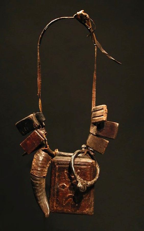 A talisman necklace of the Fulani people. Leather and metal.