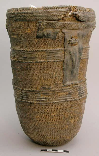 Woven fiber and leather basket of the Dinka tribe.