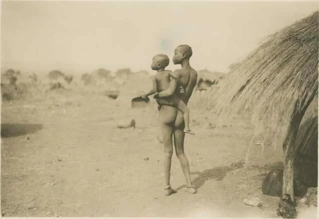 faces woman and hut.jpg