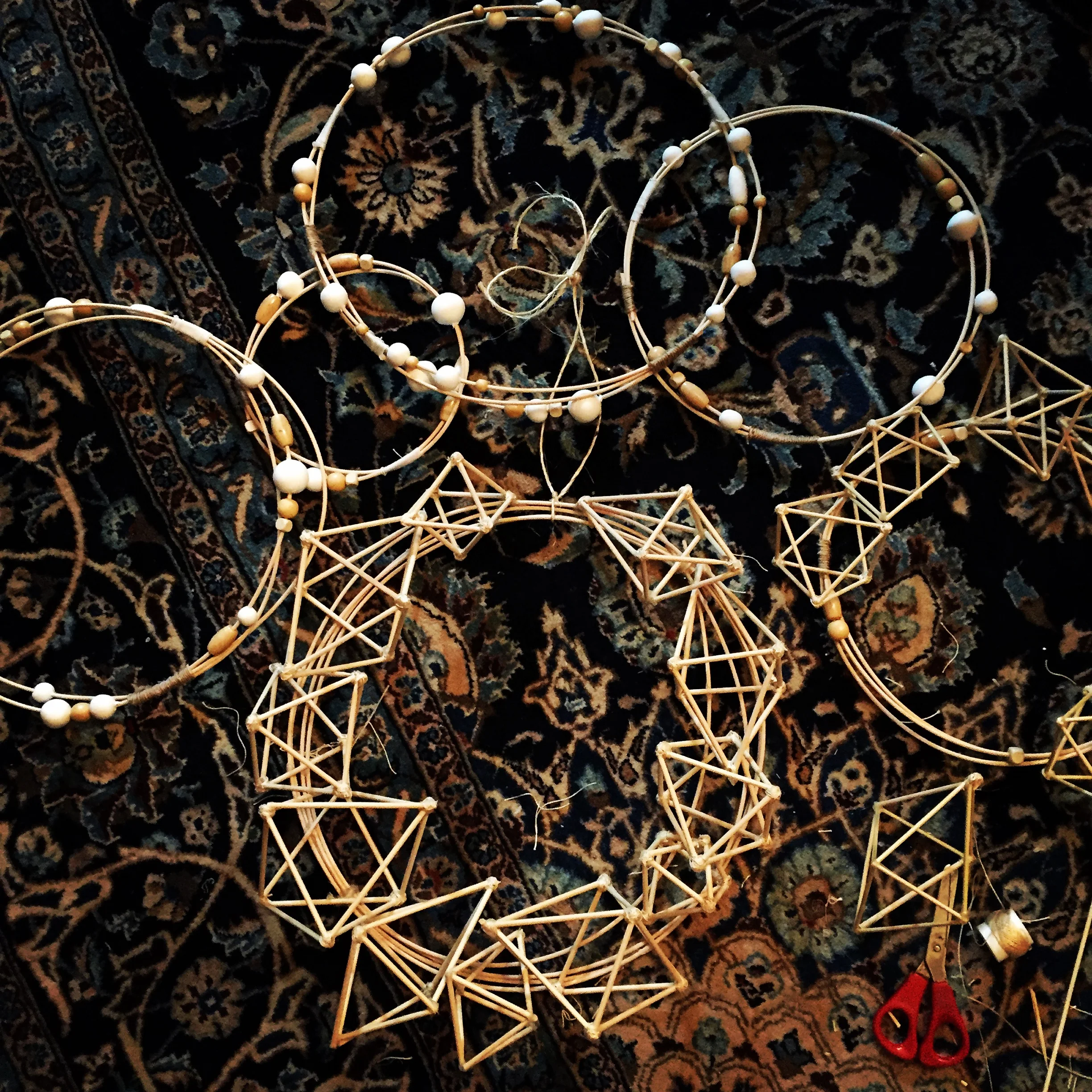 himmeli-inspired hand-sculpted wreaths featuring hand-made paper clay and wooden beads