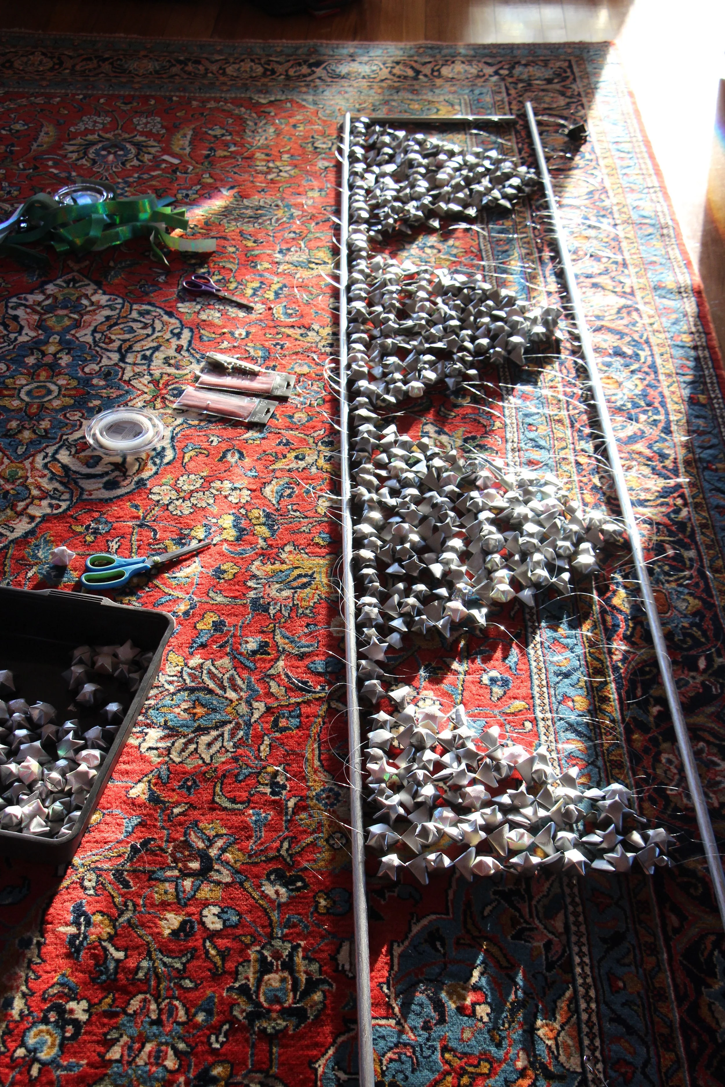 A work in progress! The installation looked beautiful first thing in the morning - the silver catching and reflecting the sunlight.