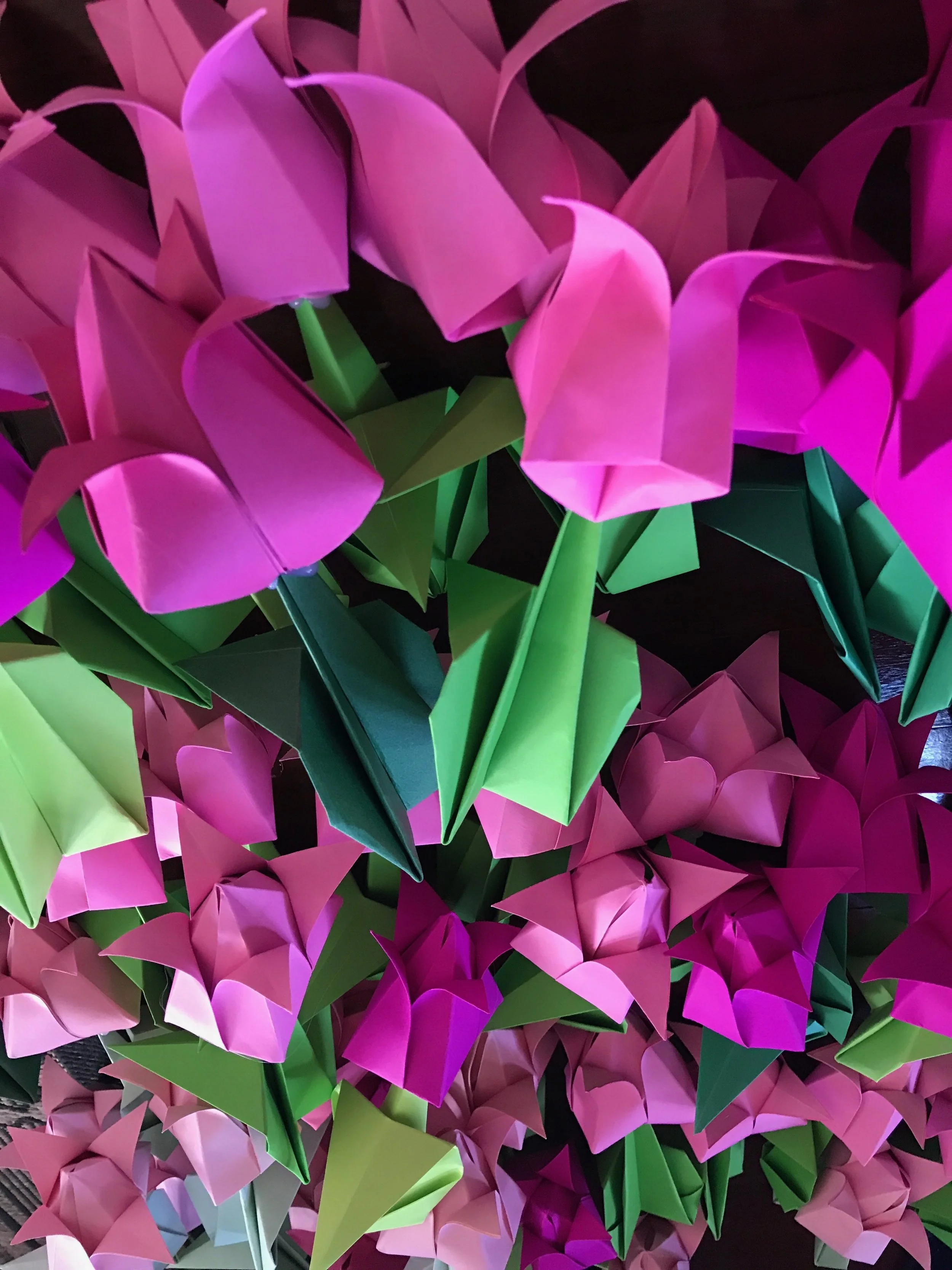 Once I had folded the separate bulb and stem elements, I created the tulip by inserting the stems into the bulbs. For extra strength, I used my hot glue gun to seal the join.