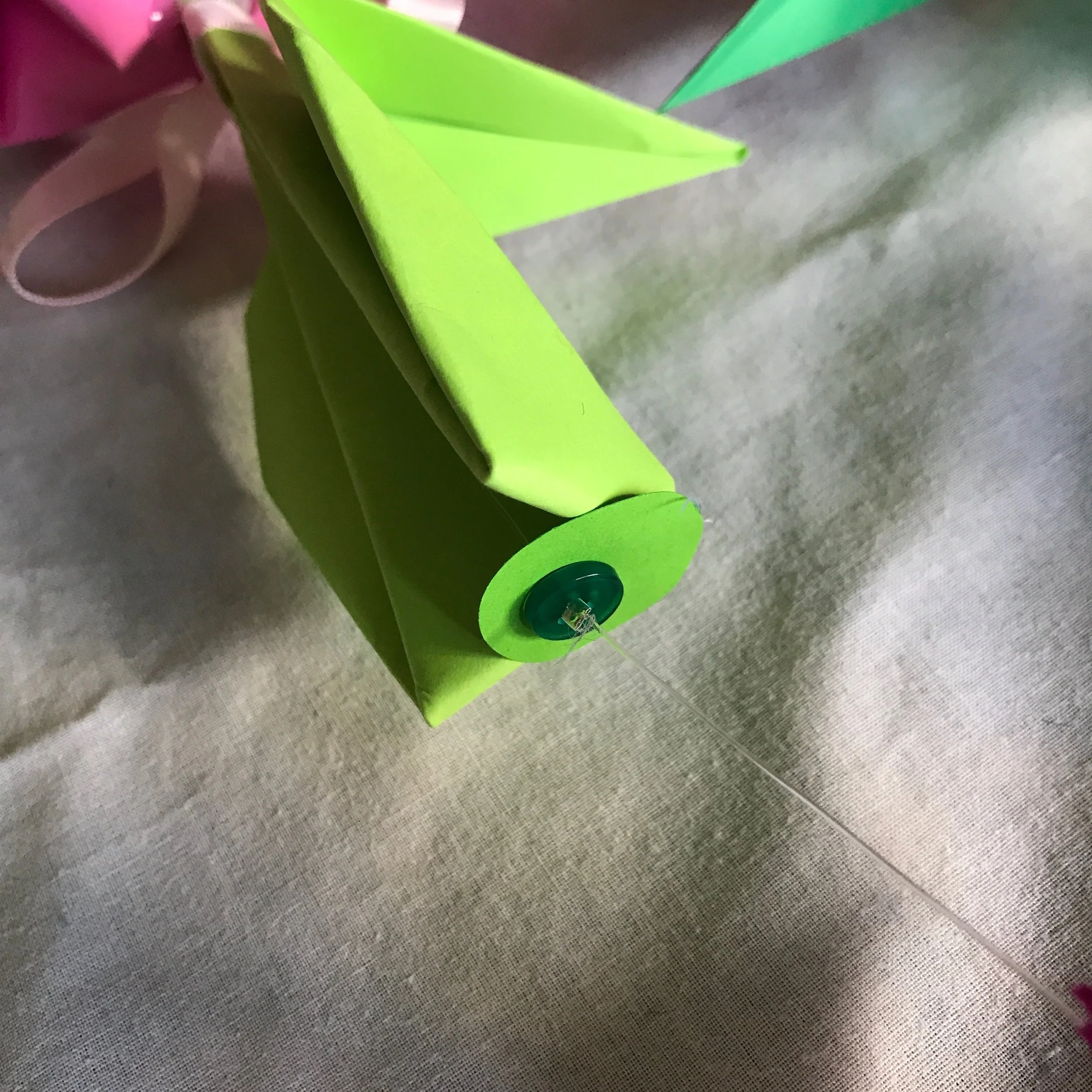 The tulip base with the disc and small button.
