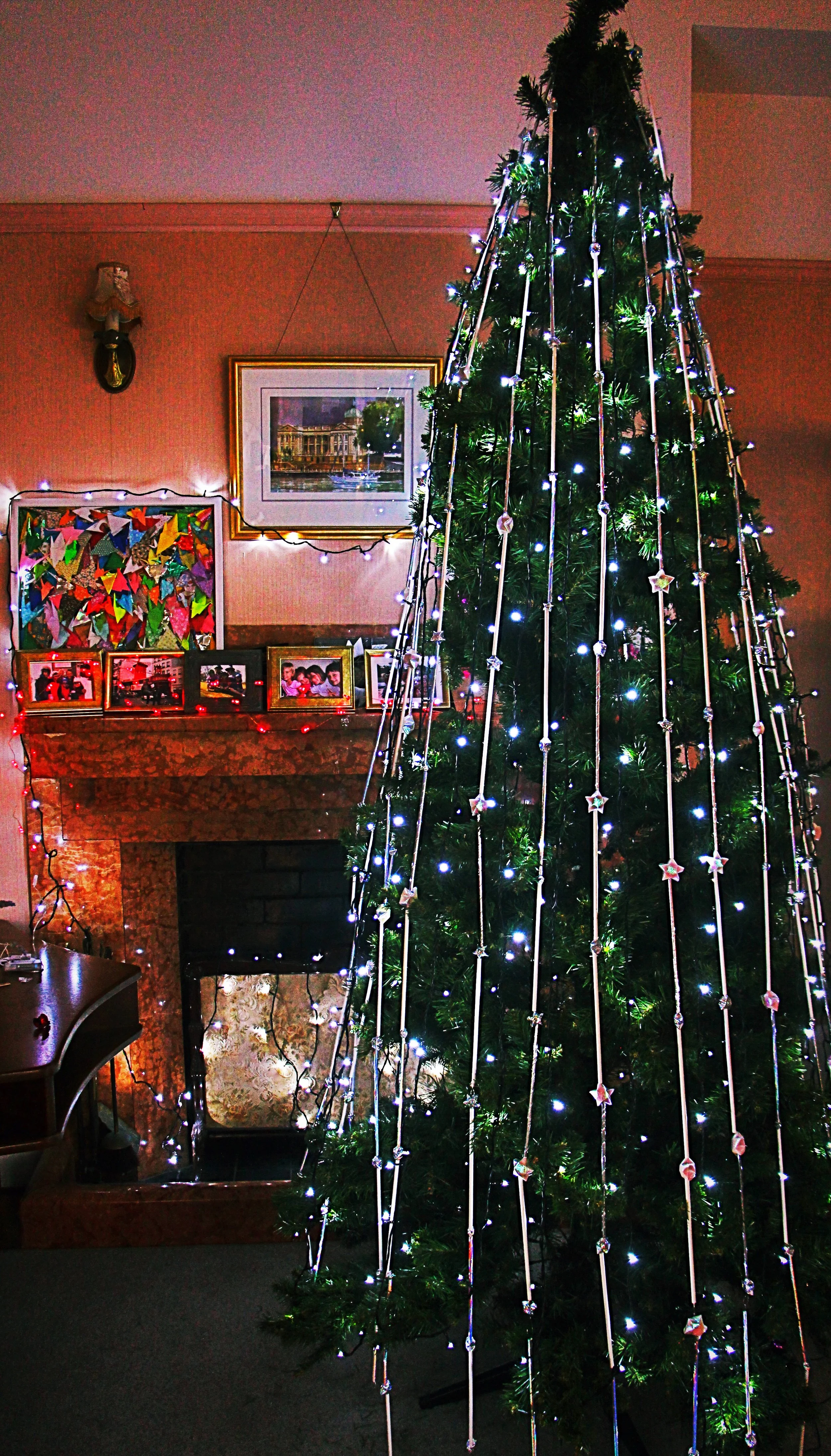 hand-made and threaded starry tree decorations - featuring little holographic origami stars and holographic, silver and white paper straws