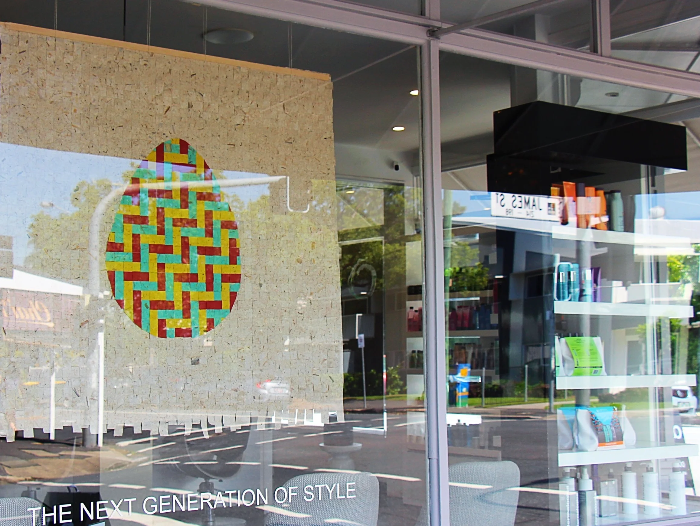 Woven-paper egg installation celebrating Easter at Orb Hair, New Farm