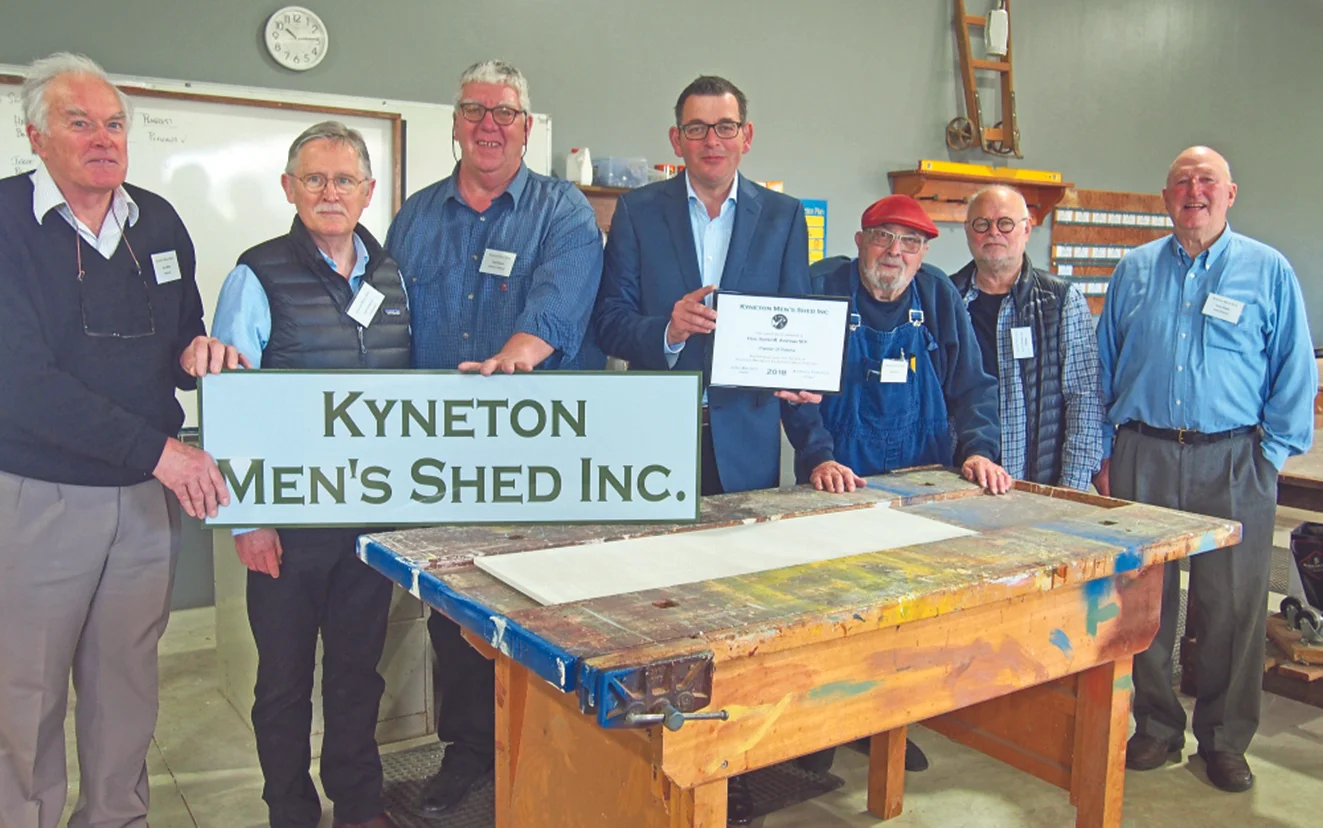 Noel Henderson supporting Kyneton’s Men’s Shed. Pictured with Premier Daniel Andrews and members of the Men’s SHed