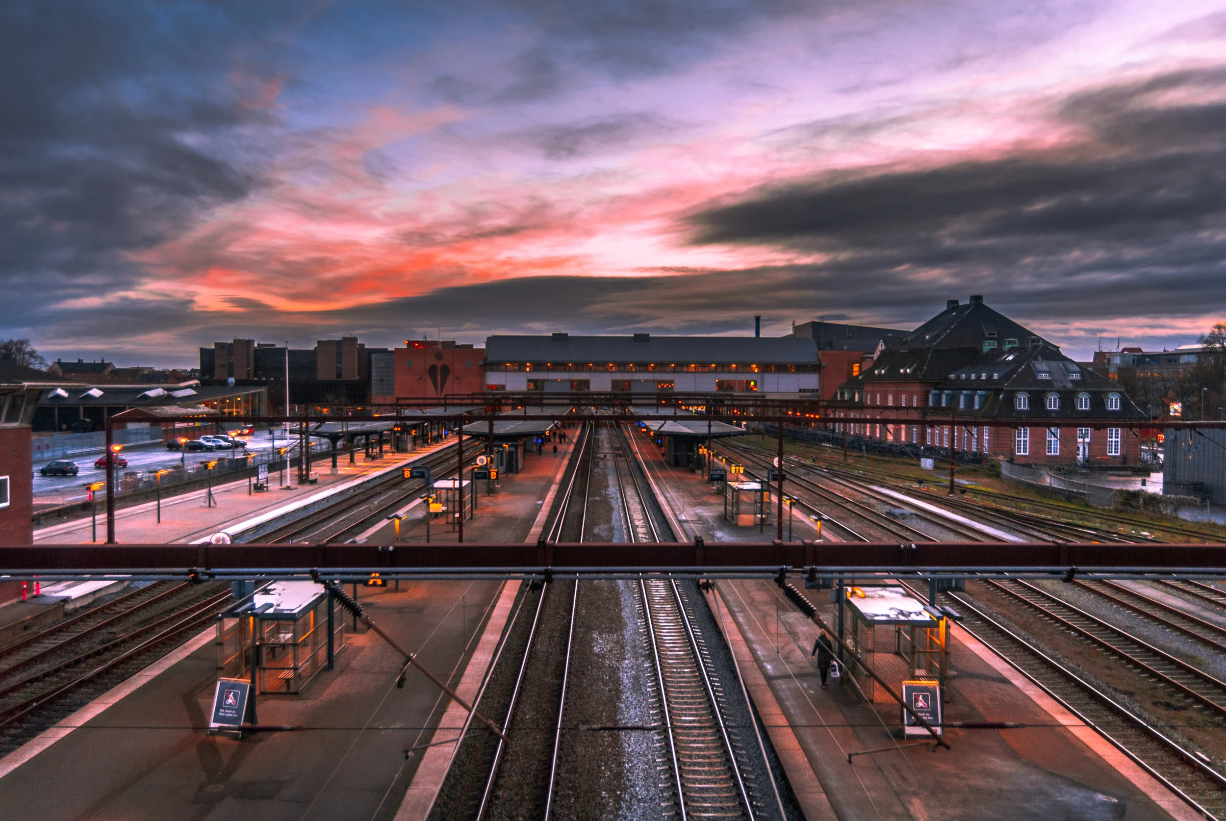 Early mornings on the train station always have a special mood to them. People are cold, the soft lights illuminating scarcely their surroundings and the rumble of trains everywhere all remind me of when it's time to travel. This is what I tried to capture in this scene. Nikon D200.
