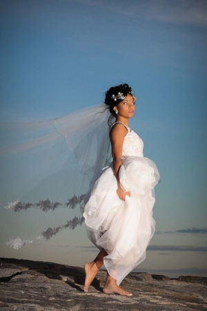 Barefoot bride on the beach at sunset - Pearl Weddings & Events