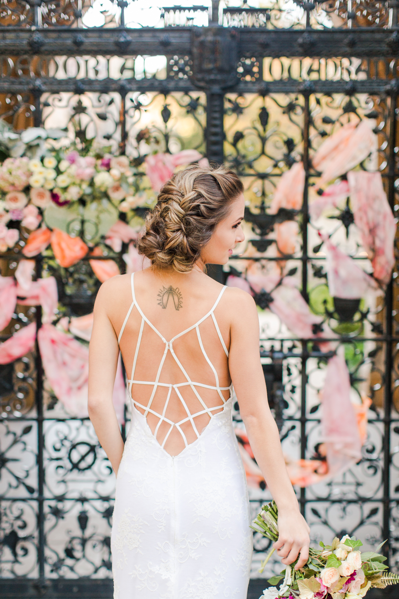 Brides intricate back strap dress with delicate lace - Pearl Weddings & Events