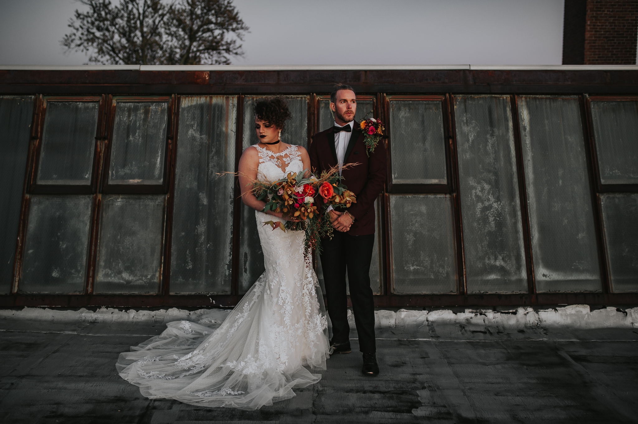 Power couple with Liliian West gown and JTGhamo maroon suit - Pearl Weddings & Events