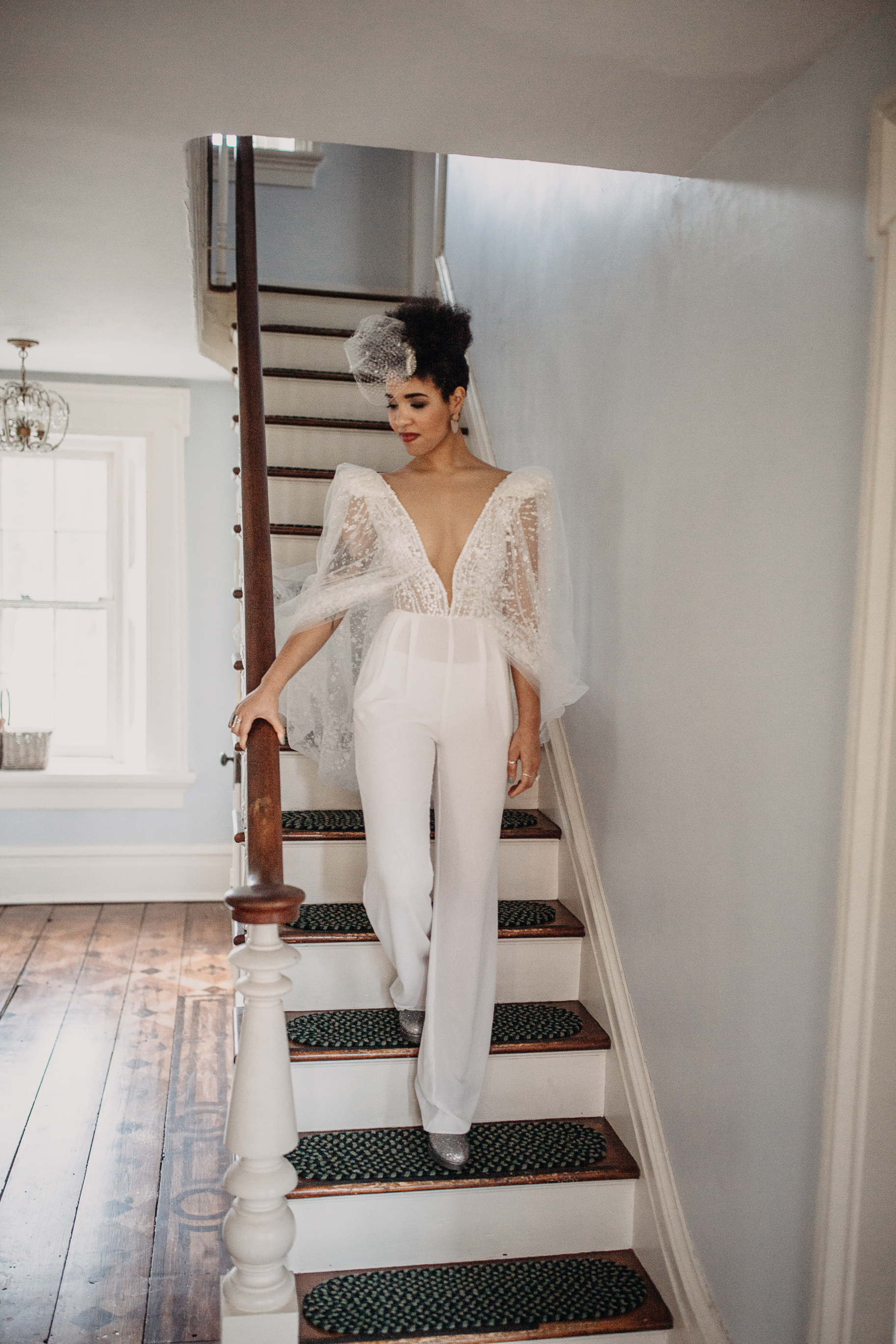 Pant suit wedding gown with a cape from Dany Mizarachi Bridal - Pearl Weddings & Events