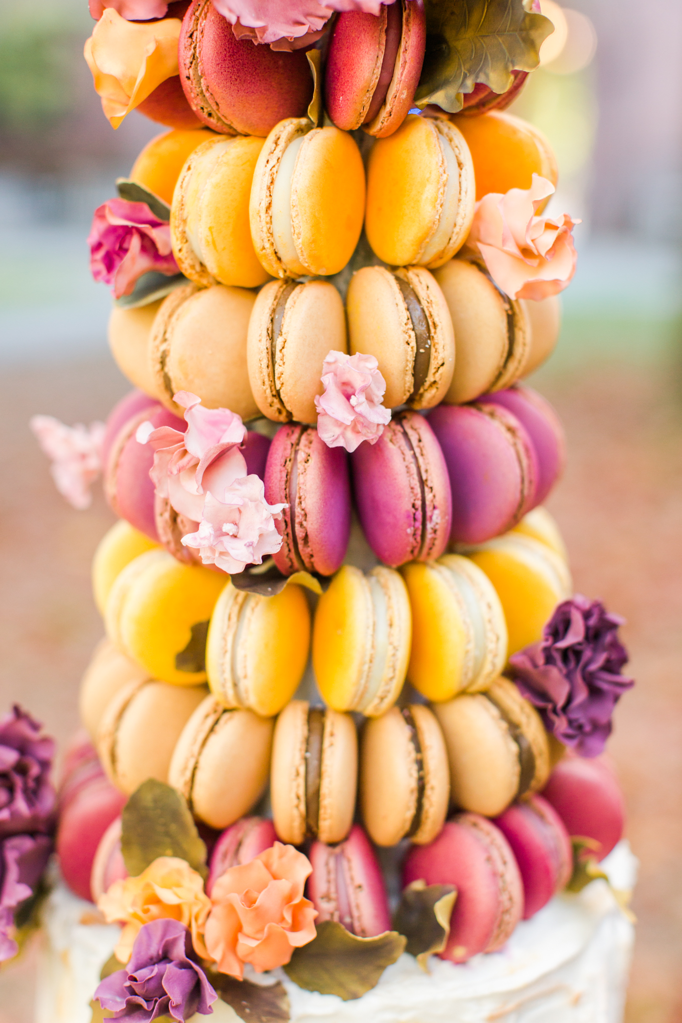 Macaroon tower wedding cake. Color scheme: pink, orange, purple and yellow. Pearl Weddings & Events