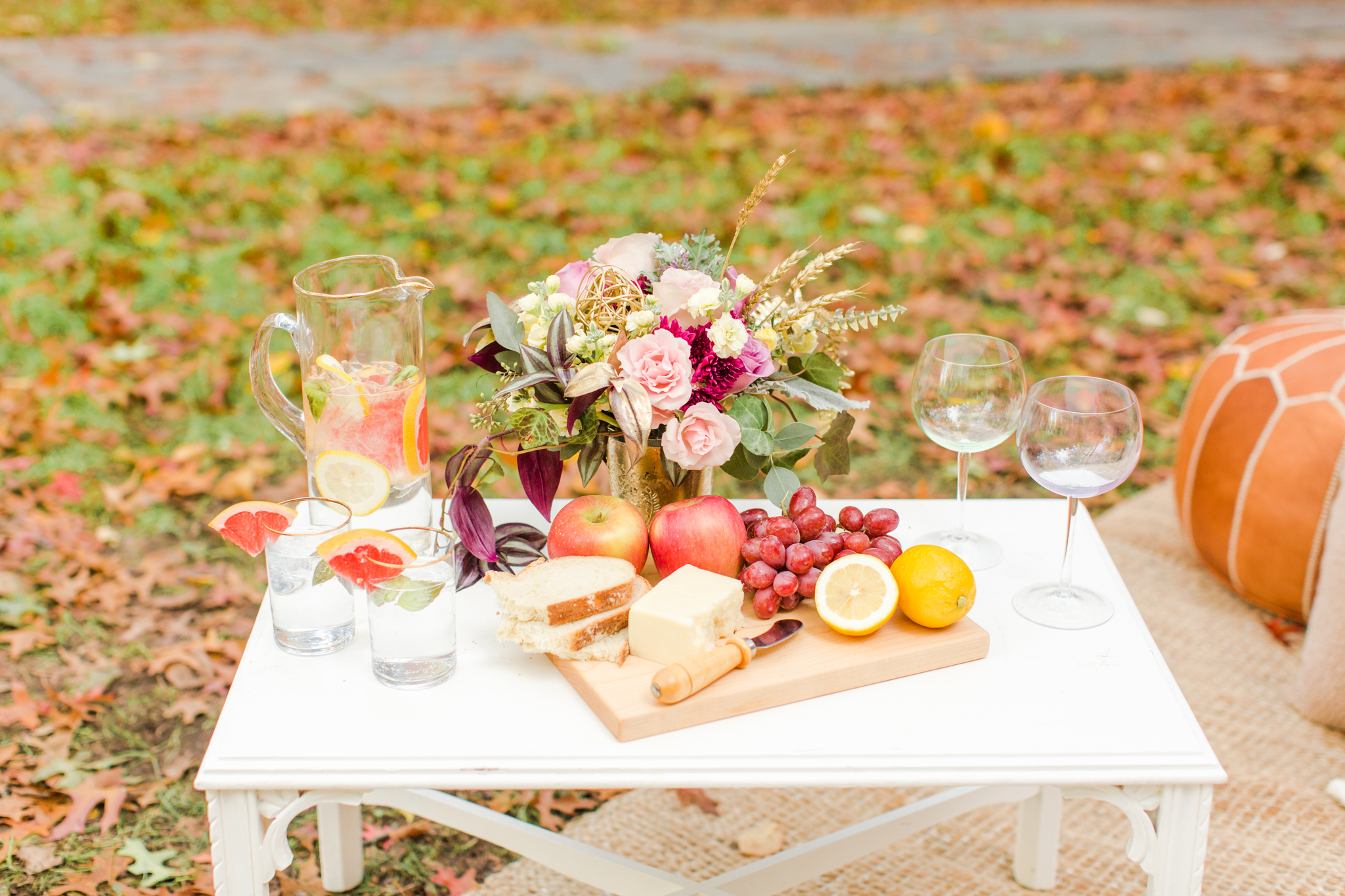 Wedding elopement appetizer spread with cheese, bread, grapes and apples. Grapefruit, mint and gin wedding cocktail! Pearl Weddings & Events