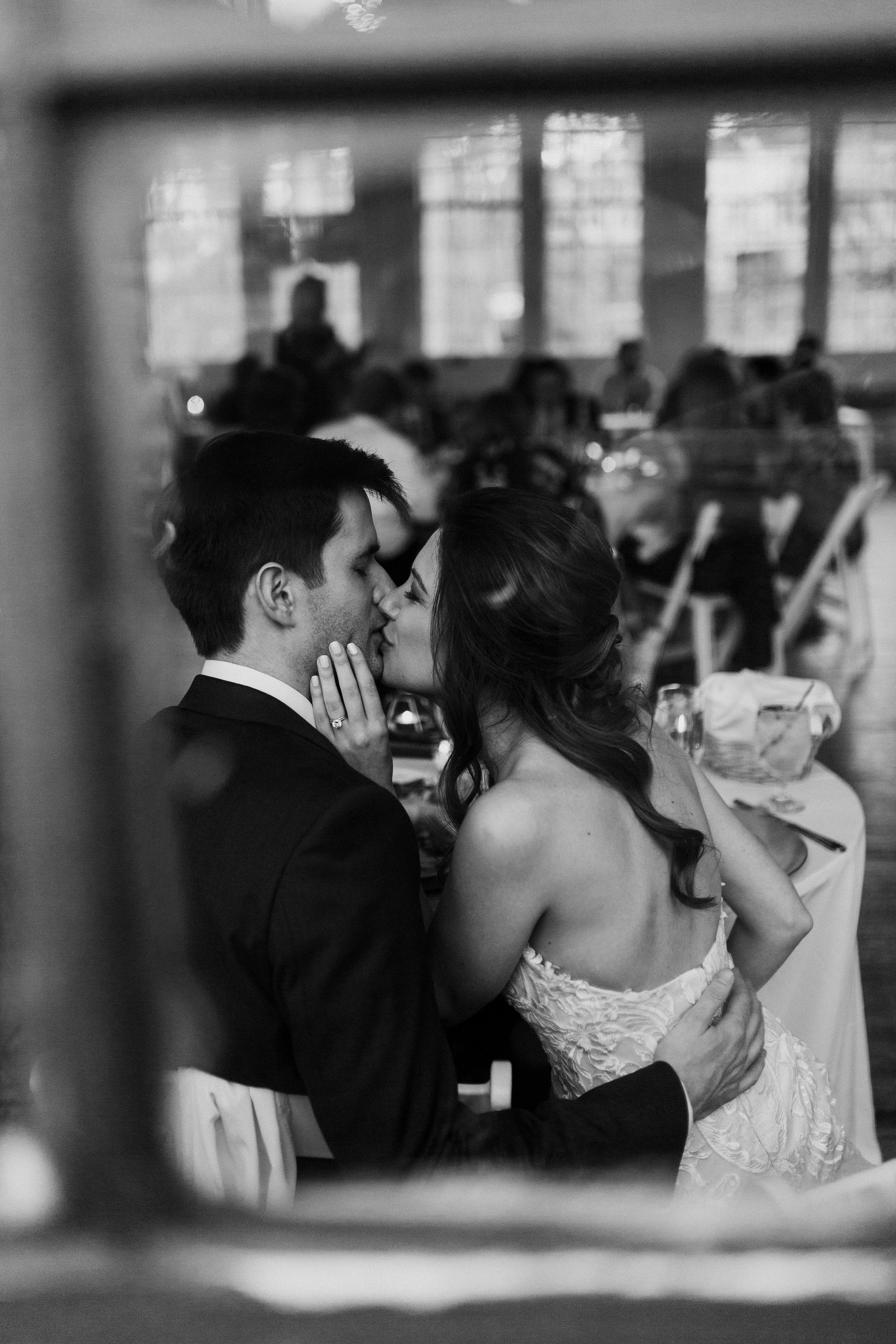 Catching those kisses from the bride and groom. - Pearl Weddings & Events