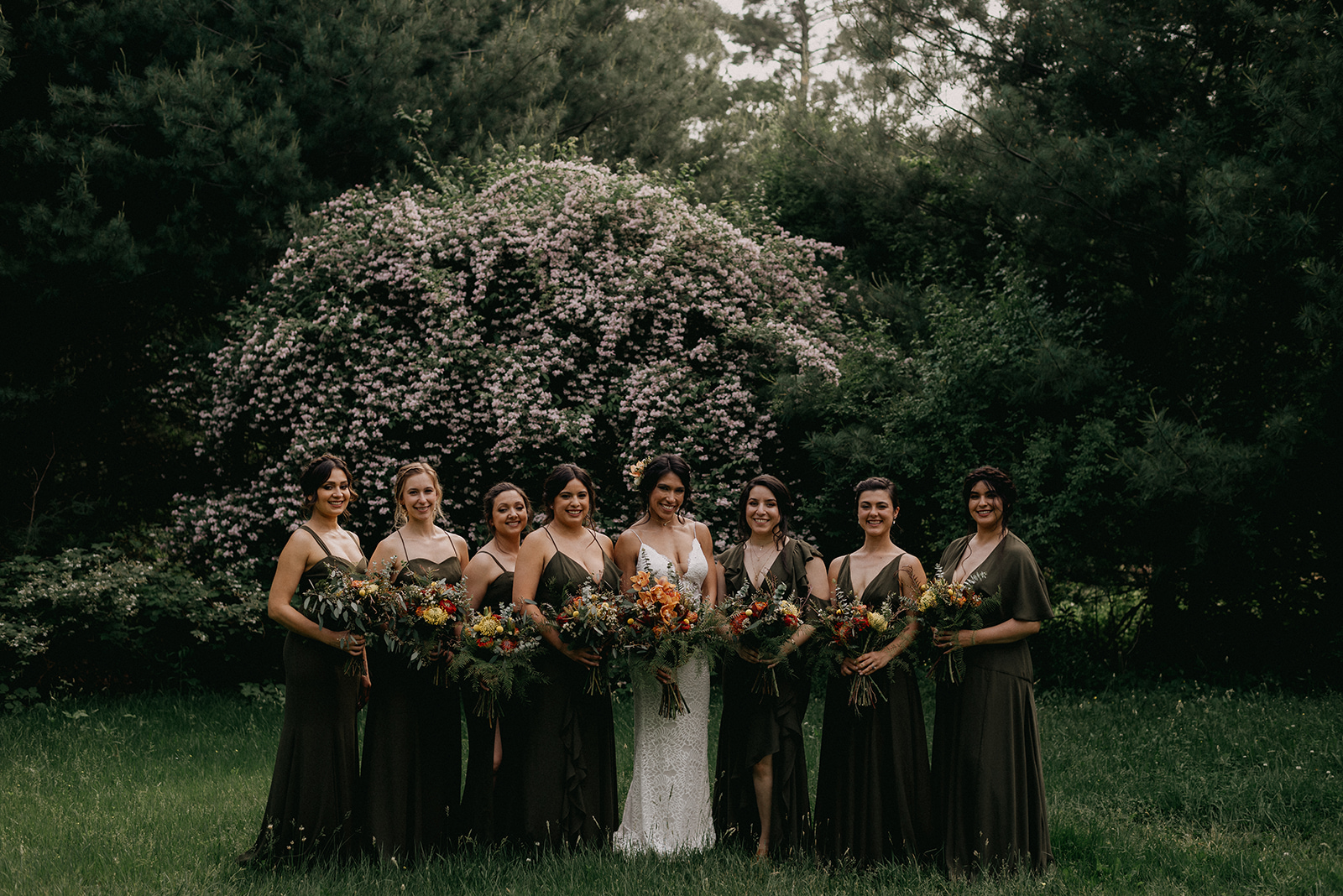 The bridal party in forest green dress of all different designs - Pearl Weddings & Events