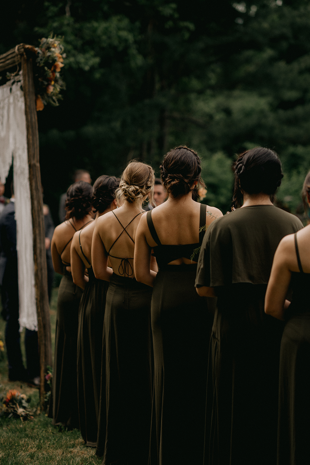 Forest greens dresses of bridesmaids from the back - Pearl Weddings & Events