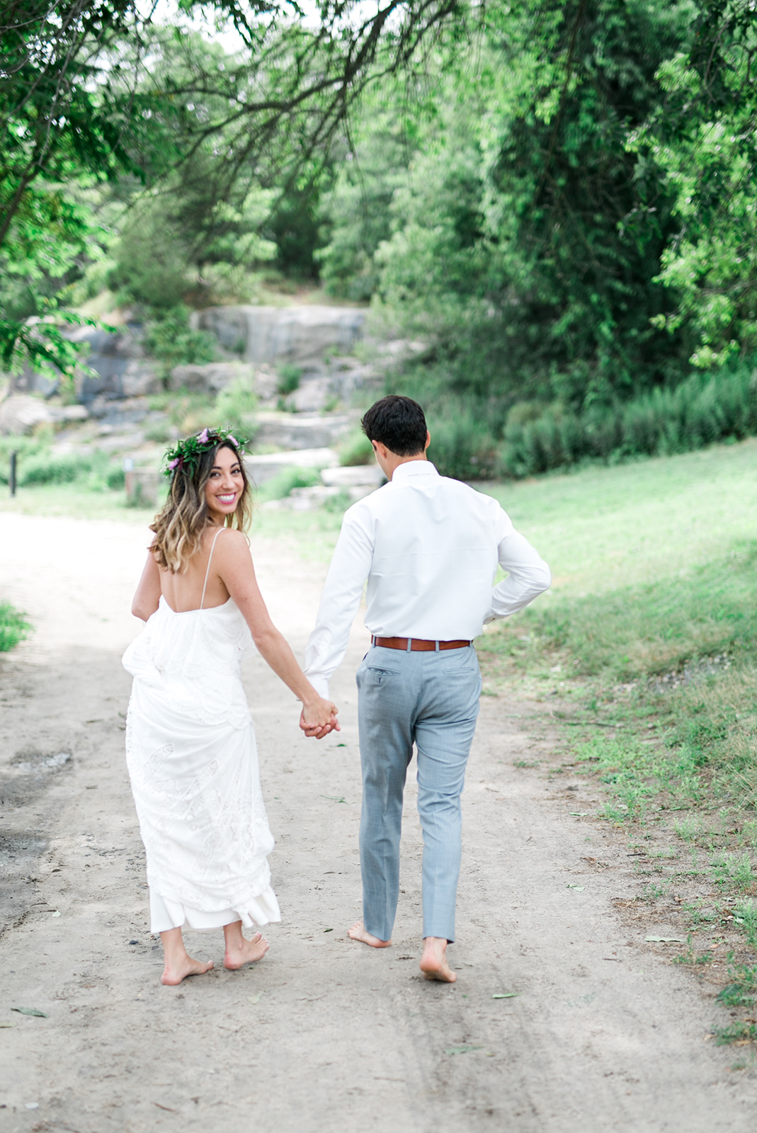 Bride and Groom walking Rocky Neck State Park in Connecticut - Pearl Weddings & Events
