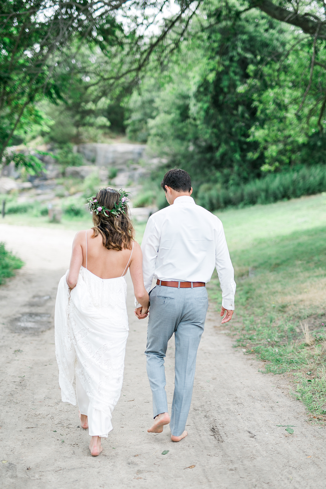 Bride and Groom walking Rocky Neck State Park in Connecticut - Pearl Weddings & Events