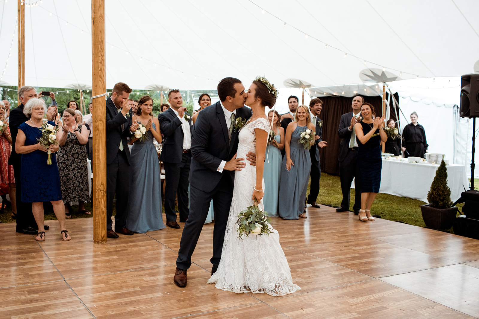 Outdoor sperry tented wedding with a wooden dance floor. - Pearl Weddings & Events