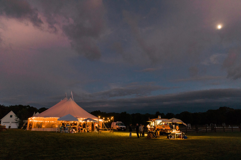 night time tent light up with cafe lighting - Pearl Weddings & Events