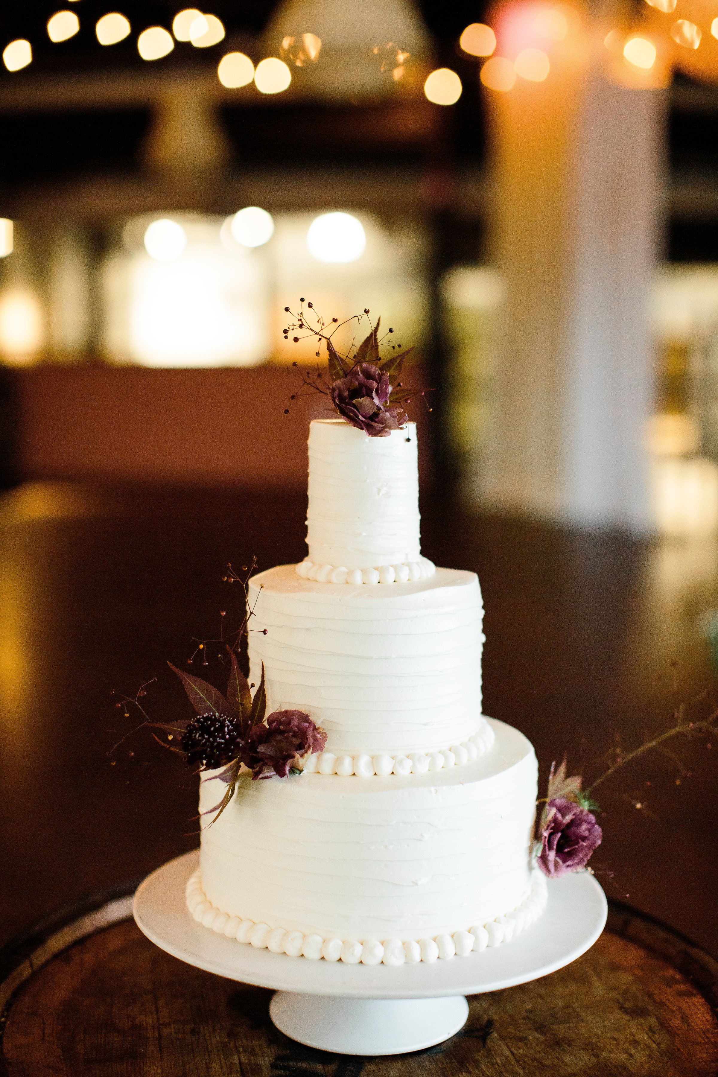 Three tiered (top tier small) white cake from LaCuisine - Pearl Weddings & Events