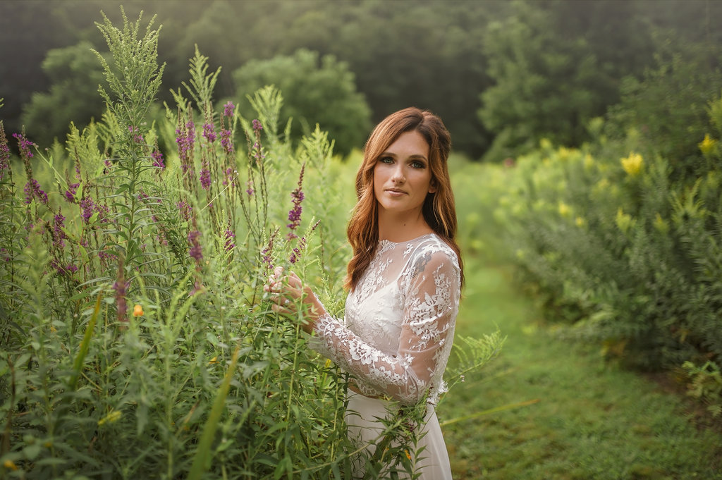 Bride in a two piece wedding dress in a lavender field in New Fairfield Connecticut - Pearl Weddings & Events