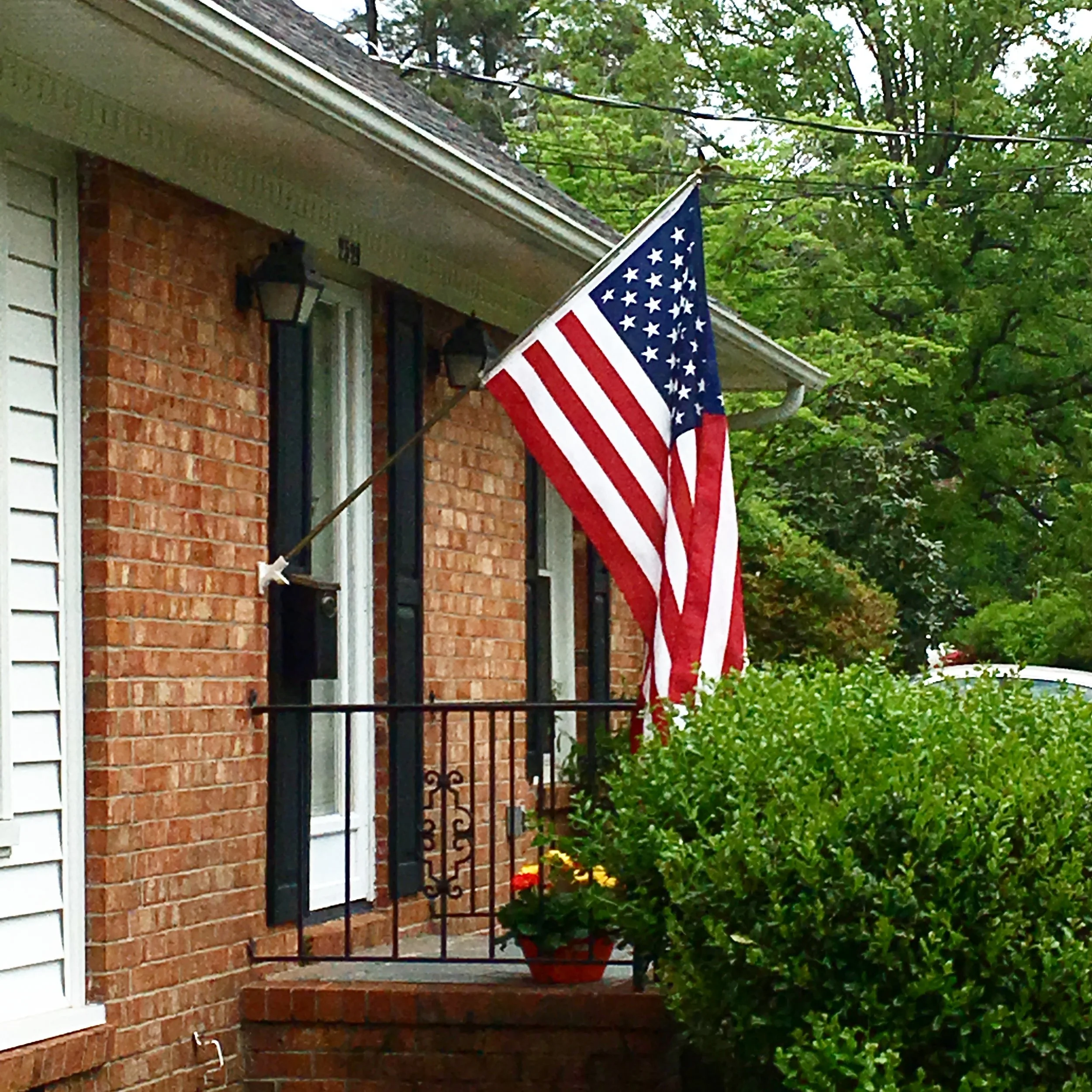 1027 || Heading out to run errands before my next class. It makes me so happy to see this flag flying from the house again. On my #100daysofeverydaylifephotos project I added: "Maybe it's because my brother was a Marine. And my uncles are all prior service, my father too. Maybe it's because I am not a retired veteran and my husband is active duty, most of my friends are serving or have served. I've lost of my best friends from high school while he served under this flag and his mother was handed one in place of her son coming home alive. Maybe it's because of the time I was raised in, when we respected that flag, held our hands over our hearts, and flew that flag with pride. That is still how I feel to this day. I was alive for 9/11, my brother served during then.... that flag is still a symbol of this country and I have pride in it. That's why it hangs on my house."