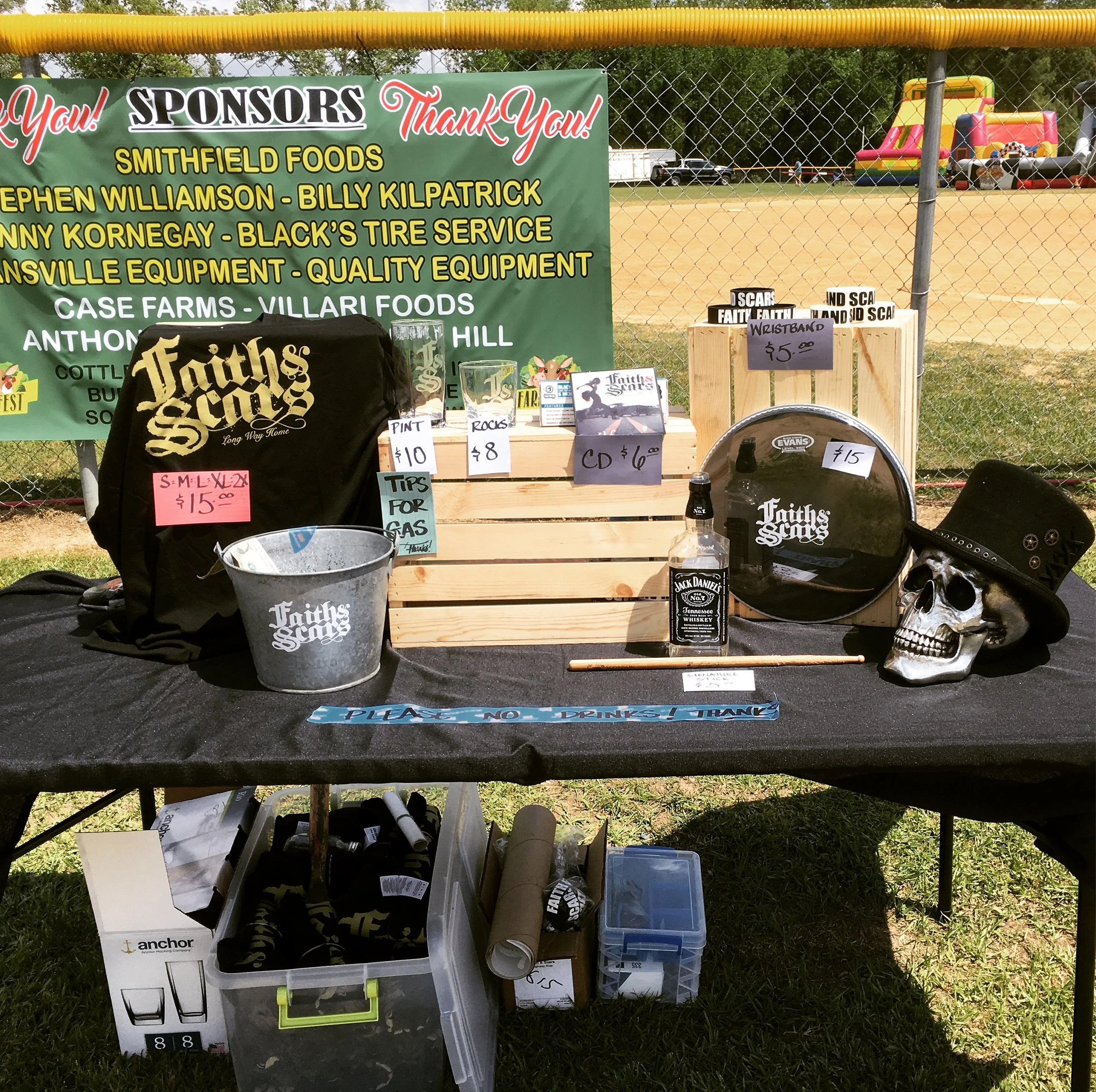 1352 || Merch table is all set up. Too bad we forgot the chairs (my bad) and have no shade (not our fault - this is where the new manager put us). It was super windy outside so we almost lost some merch a couple of times. 