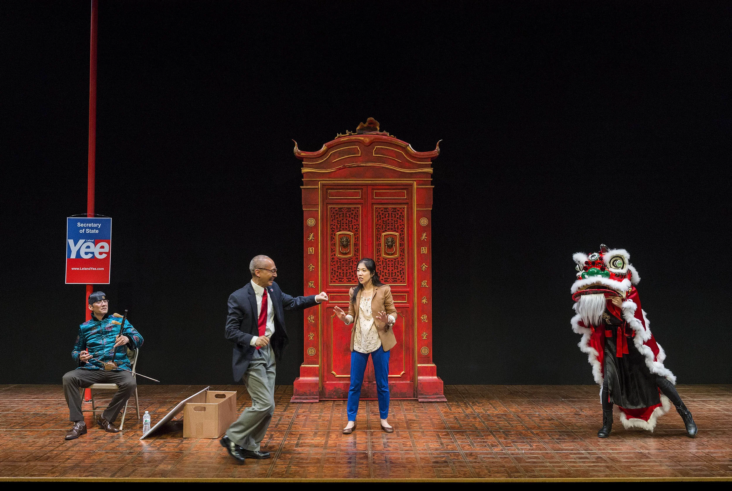 Daniel Smith, Francis Jue, Stephanie Soohyun Park, and Angela Lin under that dancing lion costume.