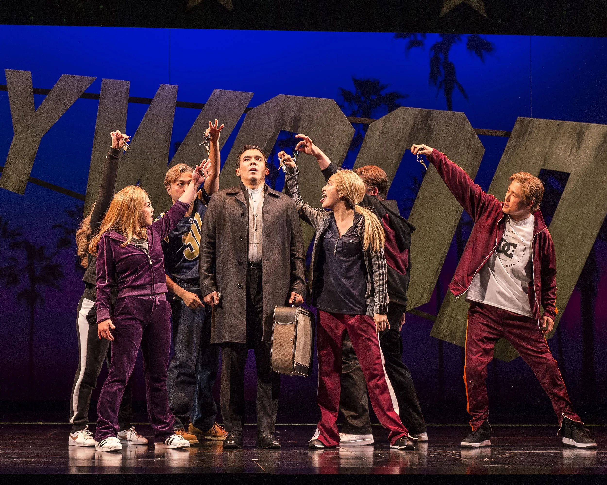 Maria-Christina Oliveras (obscured), Geena Quintos, Billy Bustamante, Conrad Ricamora, Jaygee Macapugay, Jon Hoche and Daniel May in the world premiere of David Henry Hwang and Jeanine Tesori’s “Soft Power” at Center Theatre Group/Ahmanson Theatre.