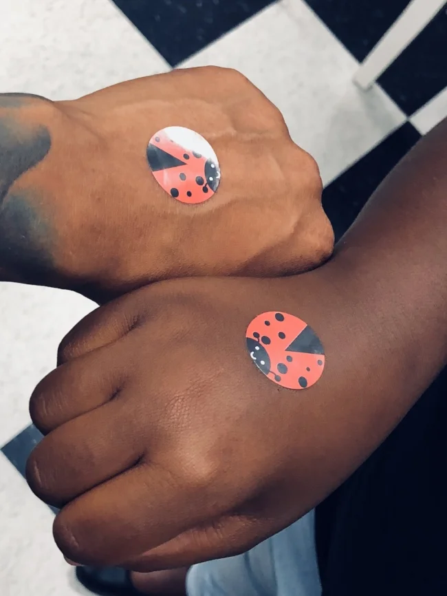 the complexion contrast between me and the little ladyBug