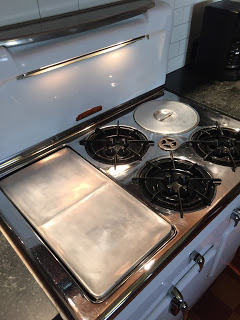 A polished griddle on a restored vintage Chambers stove model 90c