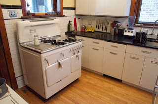 A modest and elegant setting, brilliantly remodeled with vintage steel Geneva cabinets in a Chicago two-flat.