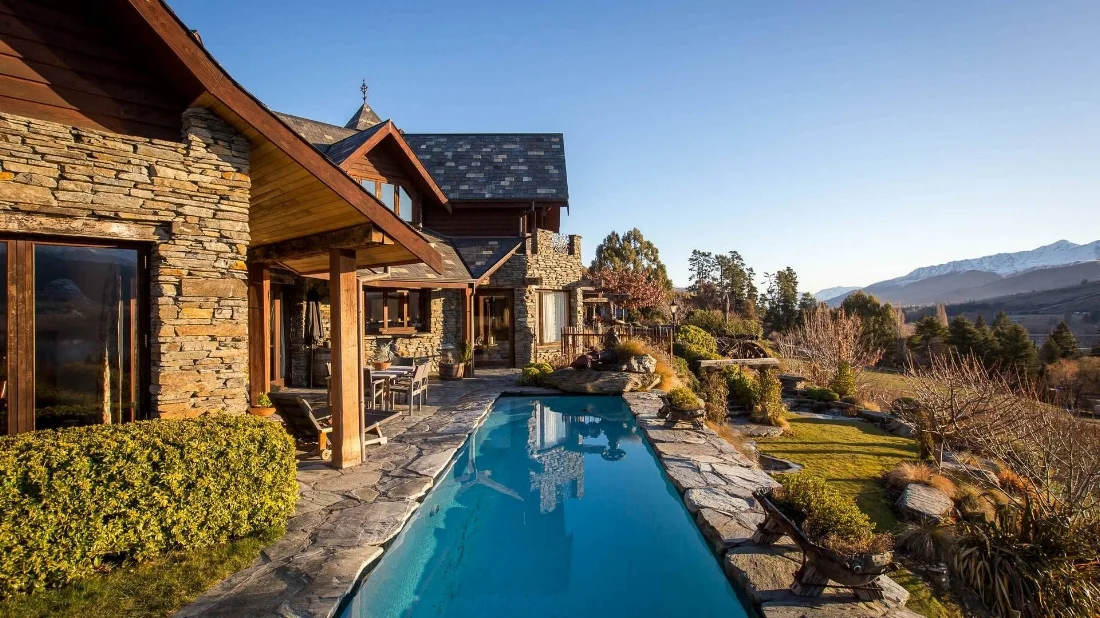 Stoneridge Estate on the hill overlooking Lake Hayes within vineyards.