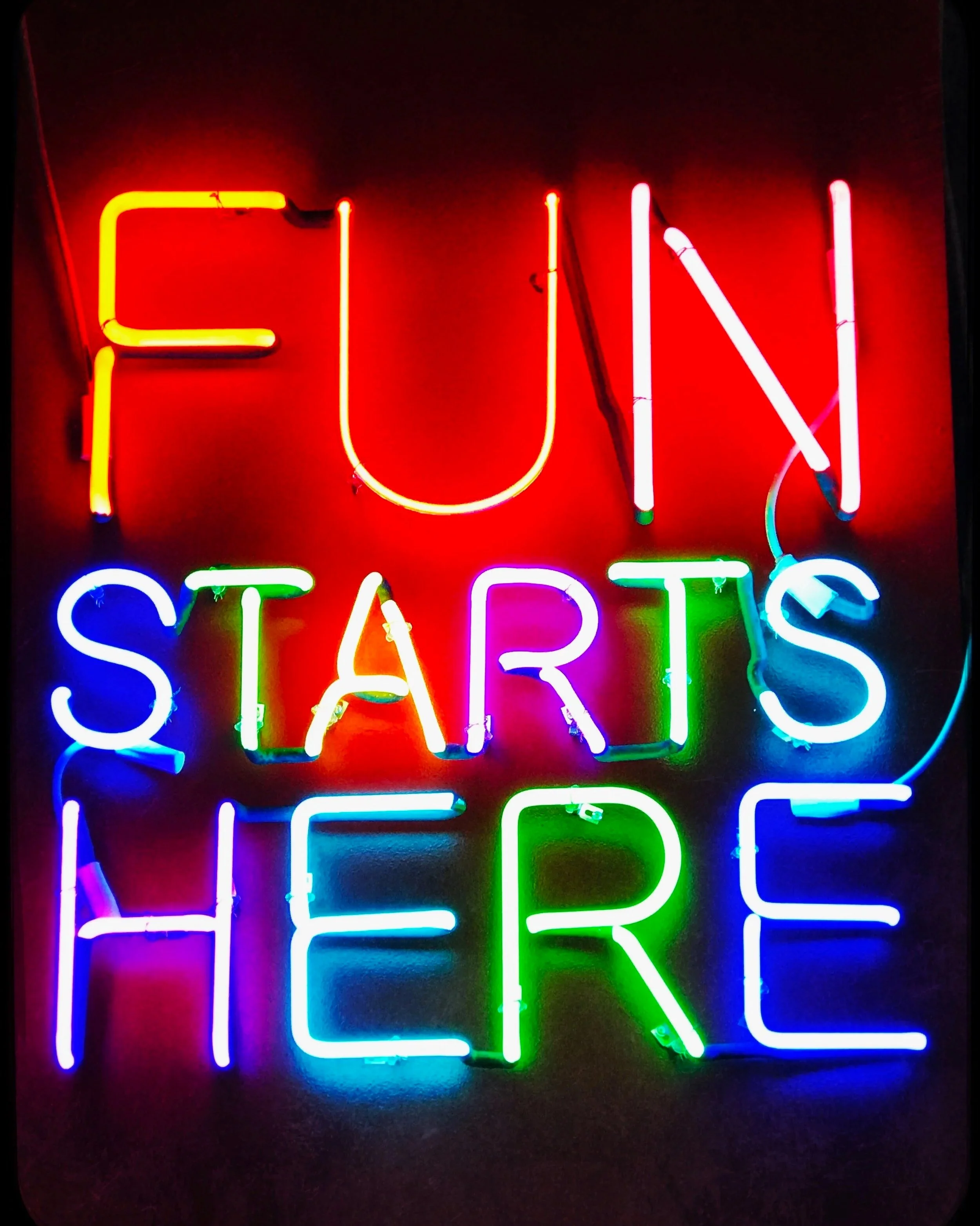 fun starts here neon sign, rise creative custom signage for Anne McGilvray & Co.
