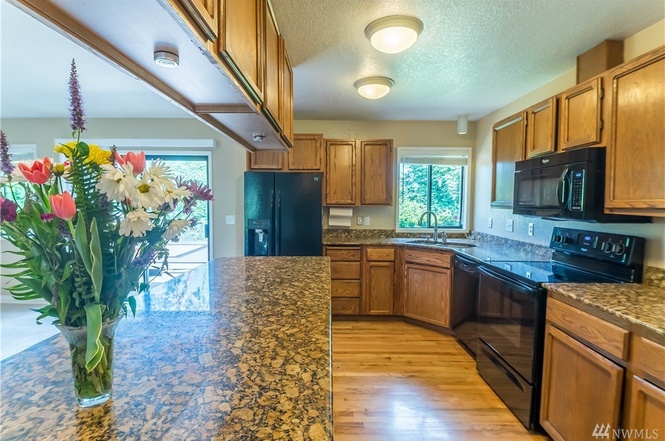 Wonderful storage, hardwood floors, and great countertops in the kitchen.