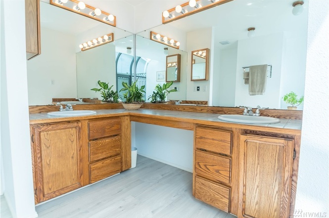 His and hers sinks, ample storage, and easy to maintain floors.