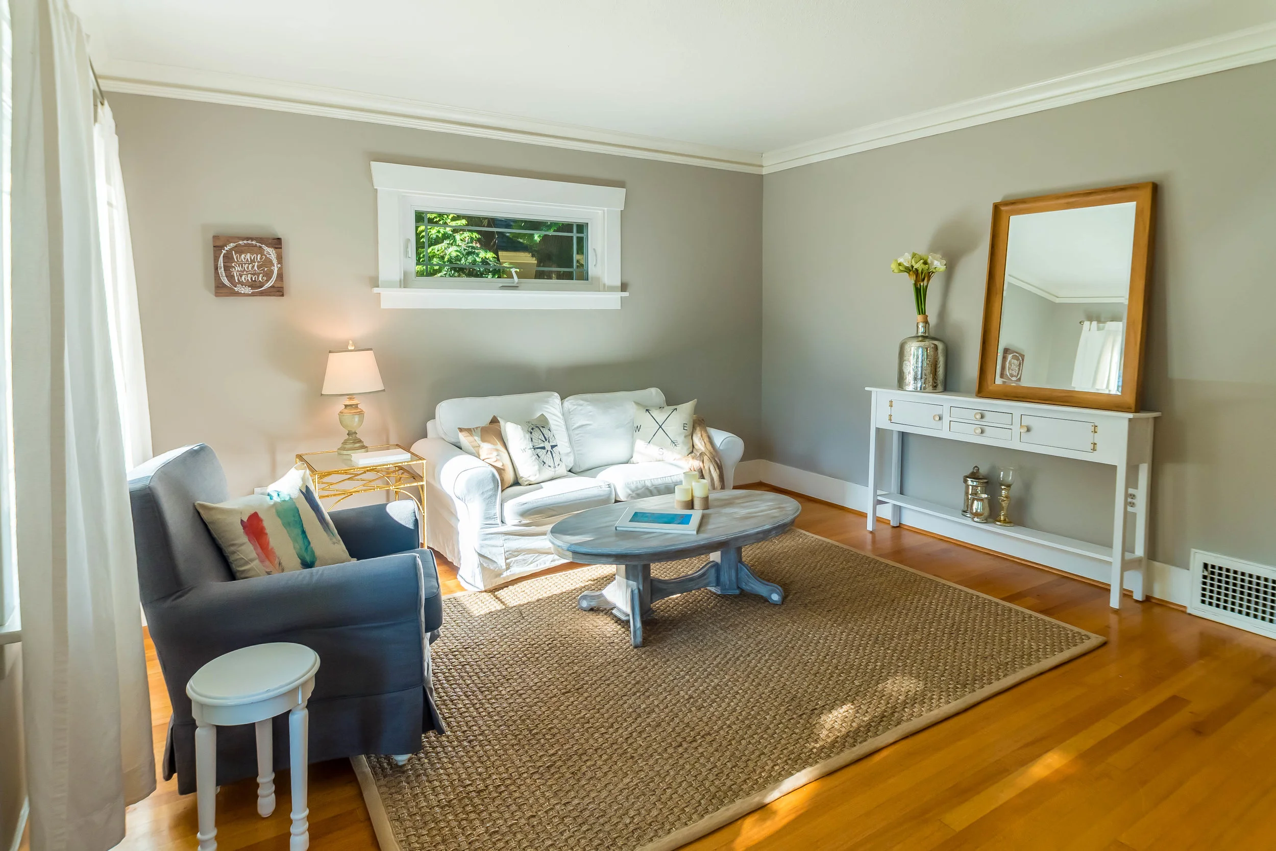 Brightly lit living room welcomes you in from the front entrance. 